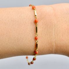 With an origin likely on the continent, this handmade natural coral beads bracelet is made with buttery tone solid 18ct Yellow Gold.  The natural coral beads are connected with multiple geometrical shape links, forming a delicate and graceful coral gold bracelet. These coral beads have natural texture, they are beautiful with intense orange colour blends and natural texture.  The natural coral beads are individuals hand crafted and set in 18ct Yellow Gold. Secure with a spring ring clasp, the bracelet measures approximately 7.25 inch or 18.5cm long. In excellent condition, comes with gift presentation packaging. Metal: 18ct Yellow Gold Stamp: 750 Weight: 3.14gm Condition: Excellent Dimensions: Overall length is 7.25 inch or 18.5cm long. The links are 1.3mm wide All gemstones have been prof Coral Jewelry Set, Resize Ring, Pearl Jewelry Design, Gift Presentation, Coral Bracelet, Orange Colour, Coral And Gold, Natural Coral, Coral Jewelry