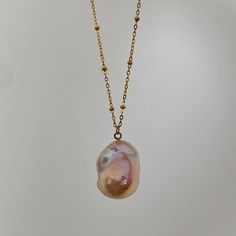 🌈Colorful Baroque Pearl Necklace 🌈 This Baroque Pearl Pendant Necklace features a handpicked, one-of-a-kind natural baroque pearl with a colorful orange-pink lustre, suspended from a waterproof stainless steel chain. *This is a handpicked, one-of-a-kind baroque pearl pendant, you will receive the exact necklace in the picture. :) * MATERIALS: Natural Baroque Pearl, Stainless Steel FINISHING: 18K Gold-Plated LENGTH: Around 48-49cm (non-adjustable) PENDANT DIMENSION: Approx. 22x17mm *Natural mat Multicolor Necklaces With Pearl Charm As Gift, Multicolor Pearl Charm Necklace For Gifts, Multicolor Jewelry With Pearl Charm As Gift, Multicolor Jewelry With Pearl Charm For Gift, Multicolor Pearl Charm Jewelry As Gift, Multicolor Pearl Chain Jewelry For Gift, Multicolor Pearl Charm Jewelry Gift, Handmade Pink Drop Necklaces, Multicolor Pearl Drop Jewelry As Gift