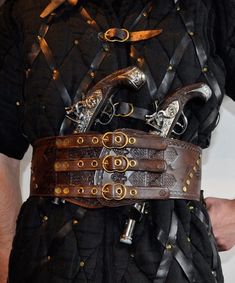 A belt, perfect for cosplay. Viking or pirate style. Buckles are hand forged from brass. Belt has 2 metal rings to hang additional equipment. Pistols are not included.  Size: Standard Length:  From 87,5 cm  (34,45 inches) to 97,5 cm (38,39 inches) - can be customized Width: - narrowest: 10,1 cm (3,98 inches) - widest: 13,3 cm (5,24 inches) Skin thickness: 3 mm (0,12 inches) - 4 mm (0.15 inches)  I can customize the size of the belt. If you want to, please select the "CUSTOM SIZE" option and writ Pirate Knife Belt, Leather Barbarian Belt, Leather Viking Costume, Fantasy Belt Leather, Leather Adventure Belt, Medieval Accessories Modern, Pirate Belt, Archer Costume, Cosplay Style