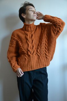 100% Hand knit SIZE: XS/S/M (Model in the photos is size S) Measurements: (Lying flat) Shoulder to shoulder - loose fit Armpit to armpit - loose fit Total length - 53 cm COLOR: orange/ rust MATERIAL: Wool - 55%; polyester - 45% CARE: Hand wash or machine wash at 30o. I would recommend to hand wash in luke warm water. Lay flat to dry on top of a towel. Shipping* I ship from Latvia EU worldwide. Estimated delivery time to: - Latvia, Lithuania, Estonia: 2-3 Business days; - European Union: 5 - 10 B Oversized Knitted Winter Sweater, Oversized Knitted Sweater For Winter, Wool Cable Knit Sweater For Cold Weather, Fall Chunky Knit Merino Wool Sweater, Cozy Cable Knit Acrylic Sweater, Winter Acrylic Cable Knit Cropped Sweater, Cable Knit Sweater For Winter, Chunky Knit Wool Sweater For Fall, Merino Wool Crew Neck Chunky Knit Sweater