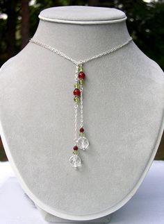 Sterling Silver Quartz Crystal Lariat Necklace Made with Clear Rock Quartz Crystal, Carnelian, and Peridot, in Sterling Silver or Gold Filled. This Universal Healing Quartz Sterling Silver Lariat / Lasso Necklace is made with genuine gemstones. If you like this style, we can make it in a variety of colors! Create a Custom Lariat Necklace. You can have just about any gemstone & metal combined to make a custom lariat necklace. We have an incredible inventory of Crystals and Gemstones and we would Crystal Carnelian, Lariat Necklaces, Homemade Necklaces, Lariat Necklace Silver, Necklaces Beaded, Gold Lariat Necklace, Black Onyx Bracelet, Wire Jewelry Designs, Onyx Bracelet