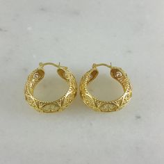 💎 Finely Crafted Jewelry. Made by master goldsmiths in Istanbul in our workshop. ❤️ Enjoy 18K gold for Less! What you see is gold, what touches your skin is 18k gold. ✓ Instant Glamour and Comfort - Statement Hoop Earrings ✓ Classic Timeless Filigree Hoop Earrings Design ✓ Length: 30 mm | 6/5 inch ✓ Width: 10 mm | 2/5 inch 100% Customer satisfaction guaranteed! Hassle free returns or exchanges. Reach out if you have any special requests and we'll make it happen! OTHER INFORMATION ✓ All items ar Luxury Gold Diamond Cut Huggie Earrings, Luxury Gold Pierced Huggie Earrings, Handmade 14k Yellow Gold Huggie Earrings, Luxury Gold Hoop Earrings With Diamond Cut, Gold Diamond Cut Oval Hoop Earrings, Gold Oval Diamond Cut Hoop Earrings, Traditional Gold Diamond Cut Earrings, Oval Gold Hoop Earrings With Diamond Cut, Classic Handmade Gold Huggie Earrings