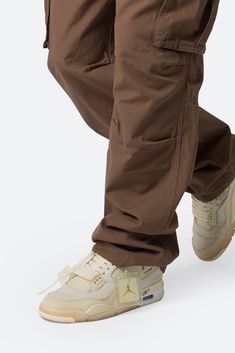 the Ultra Baggy Vintage Cargo Pants are designed with an oversized, relaxed fit throughout with gusseting at the knee, cargo pockets at the side seam, a cinch-able waistband, zipper fly, and finishing off with elastic and cargo drawcords at the leg openings. details baggy fit 100% cotton zipper fly drawcords at leg opening model is 6’1, 160 lbs and wears a size 30 note: this fit is intentionally baggy in waist and fit, for a more relaxed fit we recommend sizing down Baggy Cargo Pants Outfit, Brown Cargo Jeans, Vintage Cargo Pants, Layered Hoodie, Cotton Cargo Pants, Baggy Cargo Pants, Cargo Pants Outfit, Baggy Trousers, Loungewear Shorts