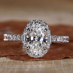 Close-up of 1 Carat Oval Diamond Ring with Halo Setting Vera Wang Halo Engagement Ring, Oval Diamond Ring With Halo, Oval Cut Ring Engagement, Oval Cut Engagement Ring Silver, Oval Engagement Ring 1 Carat, Oval Engagement Ring With Halo, Double Halo Oval Engagement Ring, Oval Wedding Rings, New Wedding Ring