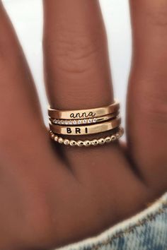 Beautiful dainty stacking name rings set, including personalized name rings and dainty gold stacking rings. This gold filled set is a great gift for mom or grandma! Discover our beautiful kids name ring stacks, the perfect sentimental gift for mom's birthday or moms-to-be! These stackable kids name rings pair perfectly with dainty gold rings & are the perfect simple meaningful jewelry pieces to add to your collection. Shop all of our custom personalized jewelry and gold name rings here! Personalized Adjustable Fine Jewelry, Adjustable Stackable Initial Ring For Everyday, Custom Name Adjustable 14k Gold Jewelry, Personalized Fine Jewelry Rings For Everyday, Personalized Fine Jewelry Rings For Everyday Wear, Personalized Everyday Fine Jewelry Rings, Mother's Day 14k Gold Stackable Rings, Dainty Custom Name Ring, Custom Name Dainty 14k Gold Jewelry