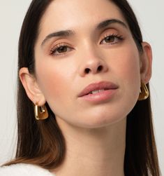 Meet these gorgeous hoop earrings. They're not just lightweight, tarnish-resistant, and waterproof, but also super chic! The puffy design gives them a modern and sleek look, perfect for any occasion. Trendy Teardrop Hoop Earrings, Modern Metal Hoop Earrings, Chic Huggie Earrings, Sleek Metal Earrings For Everyday Wear, Trendy Gold Earrings For Work, Trendy Teardrop Tarnish-resistant Hoop Earrings, Sleek Everyday Metal Earrings, Modern Hoop Earrings For Everyday, Chic Huggie Hypoallergenic Earrings