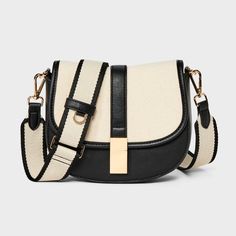 This Saddle Crossbody Bag from A New Day™ with a structured silhouette features a roomy main compartment and an interior zip pocket for easy organization of your belongings, plus an overlapping flap with a gold-tone buckle accent and magnetic closure. Plus, the detachable adjustable shoulder strap makes carrying a breeze whether you sling it over one shoulder or carry it in hand. A New Day™: Style that goes wherever you do. Black Purse Summer Outfit, Medium Size Crossbody Purse, Target Purse, Saddle Crossbody Bag, Purse Trends, Cute Crossbody Bags, Casual Purse, White Purses, Easy Organization