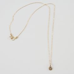 Keep it simple with the DELIA Tiny Flower Pendant Necklace. Small but with a lot of style, accentuate your look with its distinguished elegance. It grabs the attention not just by its shape but also by its charming 14K gold color. This necklace gives you all the reasons to make it a pick of the day. Features: Comfortable Lightweight Elegant and minimal High quality Hand-carved flower-shaped pendant Size & Material: Length: 17" inches Material: 14K gold chain and pendant with an inset of a diamon Elegant 14k Gold Diamond Necklace With Teardrop Pendant, Delicate Charm Necklaces With Delicate Chain For Formal Occasions, Delicate Charm Necklaces With Delicate Chain For Formal Events, Delicate Charm Necklace With Delicate Chain For Formal Occasions, Delicate Charm Necklace For Formal Occasions, Formal Delicate Charm Necklace With Delicate Chain, Elegant Teardrop Pendant Necklace With Single Diamond, Dainty Teardrop Pendant Diamond Necklace In Yellow Gold, Dainty Yellow Gold Teardrop Pendant Diamond Necklace