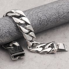 This chunky chain bracelet is artfully assembled with vari-textured pieces for a dynamic look, perfect for those seeking a contemporary hip-hop jewelry piece. The stainless steel construction ensures durability. Stainless Steel Color: Silver Chain Length 7.7-inches = 19.5 cm 8.5-inches = 21.5 cm 9-inches = 23 cm Chain Width 31 mm 20 mm 12 mm Caring for necklace tips Avoid contact with chemicals like perfume, detergent & lotion. Avoid exercise/bathing while wearing. Clean with a soft cloth. Packa Luxury Cuban Link Chunky Chain Bracelet, Stainless Steel Cuban Link Bracelet With Chunky Chain, Silver Cuban Link Necklace With Chunky Chain For Streetwear, Silver Iced-out Chain Bracelet, Silver Cuban Link Bracelet For Streetwear, Streetwear Jewelry, Hip Hop Jewelry, Hand Jewelry, Hip Hop Fashion