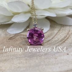 "The pendant pictured is lab created pink sapphire #6673. -Approximate total carat weight: 2.75ctw diamond equivalent -Stone Size: 9mm approx. 2.70ct diamond equivalent -Stone Shape: octagon/web cut -Gem Type: lab created pink sapphire -Stone Color: Pink -Stone Clarity: VS2 -Moh's Scale: 9 hardness Accent Stone -Stone Size: approx. .03ctw -Stone Shape: round -Gem Type: Diamond -Stone Color: G -Stone Clarity: SI1 -Moh's Scale: 10 hardness -Metal Type and Purity: 14k yellow gold -Setting: basket h Formal Pink Pendant Jewelry, Pink Sapphire Jewelry In Pink Gold With Diamond Accents, Oval Pink Sapphire Jewelry With Diamond Accents, Pink Gold Jewelry With Diamond Accents And Pink Sapphire, Dazzling Oval Pink Sapphire Jewelry, Pink Diamond Cut Fine Jewelry Necklace, Dazzling Pink Gemstone Jewelry, Fine Jewelry Pink Sapphire Round Cut, Pink Sapphire Jewelry In Yellow Gold With Diamond Accents