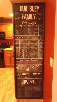 a chalk board with writing on it in a kitchen