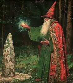 an old man with a long white beard wearing a red hat and green robe is standing in the woods next to a stone