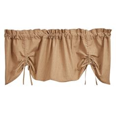 a tan curtain with ties on the top and bottom, in front of a white background