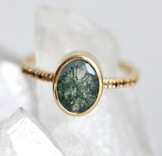 Moss agate engagment ring with an oval-cut green mossy agate gemstone and black diamond ring. Simple organic solitaire ring. We are the original jewelry designers to use moss agate and create geometric moss agate one of a kind jewelry. Please beware of other jewelry designers using moss agate as their designs are replicas of our bestsellers and cannot match our high standards of production and authentication of quality. All moss agates are natural and hand-cut, which can result in minor irregula Green Agate Ring, Oval Cut Engagement Ring, Moss Agate Ring, Black Diamond Ring, Green Agate, Agate Ring, Rose Gold Engagement, Ring Oval, Rose Gold Engagement Ring