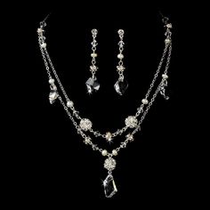 "Stylish and elegant, this silver or gold plated necklace and earring set is the perfect accessory for your wedding, honeymoon or special occasion. The set features freshwater pearls and clear Swarovski crystals, the perfect finishing touch to your vintage chic or classic wedding dress. READY TO SHIP DETAILS: - Necklace: 15\" long with a 2.5\" adjustable extender, Earrings: 1.5\" long. - Earrings - 2\" (Length) - Offered in Gold or Silver COORDINATING SASHES, CUFF BRACELETS & FASCINATORS, VI Silver Jewelry Sets With Pearl Drop For Formal Occasions, Silver Crystal Jewelry Set With Pearl Drop, Classic Silver Jewelry Sets With Pearl Drop, Classic Silver Crystal Jewelry Sets, Gold Sterling Silver Jewelry Sets For Wedding, Classic Sterling Silver Jewelry Sets For Wedding, Silver Dangle Jewelry Sets For Anniversary, Vintage Jewelry Sets For Wedding, Elegant Silver Dangle Jewelry Sets