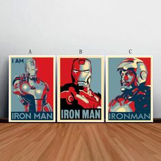 three iron man posters on a wooden floor