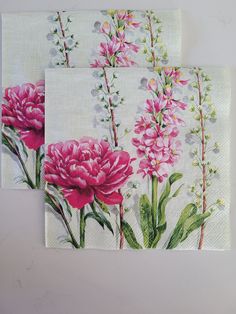 two napkins with pink flowers on them