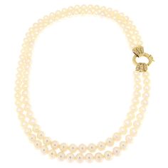 This pearl necklace, with its clasp in 18-karat yellow gold adorned with embedded diamonds, is a classic piece of jewelry reinvented with a touch of modernity. Each pearl, measuring 7 mm in diameter, has been selected for its round shape and smooth, lustrous surface, creating a sequence of elegance and sophistication that adorns the neck with a discreet yet captivating brightness. The heart of this piece, the clasp, is made of precious 18-karat yellow gold, lending the necklace an aura of warmth and value. This element is not just functional but becomes a true focal point thanks to the setting of diamonds chosen for their sparkle and quality. These diamonds add an extra dimension of luxury and brilliance, making the clasp a standout detail that captures light and attention. The combination Classic Double Strand Pearl Chain Necklace, Classic Pearl Necklace With Jewels For Anniversary, Classic Gold Diamond Pearl Necklace, Classic Akoya Pearl Diamond Necklace For Anniversary, Classic Pearl Diamond Necklace For Formal Occasions, Classic White Diamond Necklace With Pearl Chain, Luxury Double Strand Pearl Necklace For Formal Occasions, Classic Formal Pearl Diamond Necklace, Classic Diamond Necklace With Pearl Chain For Formal Events