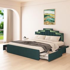 a bedroom with a large bed and green headboard on top of wooden flooring