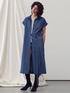 This product is a belted midi shirt dress that offers a versatile and contemporary take on the classic shirt dress. The piece features a pointed collar and a front button closure that runs the length of the dress, allowing for a customizable fit. The addition of a belt emphasizes the waist, while the midi length strikes an elegant balance between casual and formal. - The dress's side slits provide freedom of movement and a touch of allure.- Its roll-up sleeve design adds a casual, effortless look, suitable for different seasons.- The lightweight fabric ensures comfort and breathability throughout the day.- This midi shirt dress can be dressed up with heels or down with flats, making it a staple for any occasion. Classic Belted Shirt Dress For Semi-formal Occasions, Semi-formal Knee-length Shirt Dress With Placket, Knee-length Belted Shirt Dress For Semi-formal, Belted Shirt Dress For Semi-formal Fall Occasions, Semi-formal Belted Shirt Dress For Fall, Chic Spring Shirt Dress For Work, Chic Spring Workwear Shirt Dress, Chic Knee-length Shirt Dress With Placket, Fall Belted Shirt Dress With Spread Collar