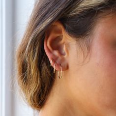 These sweet and delicate hoops are your newest addition to your earring collection! Simple and effortless, our Goldie Hoops are a favorite for everyday style. You can leave these in and always feel dressed for the right occasion - you can even buy charms from our Charm Bar to create a customized look! DETAILS Available in 14k Gold Fill or Sterling Silver 10mm, 14mm, 16mm or 24mm diameterChoose between a single earring or a pair. Hypoallergenic and water-proof Simple 14k Gold Huggie Earrings For Everyday, Simple Everyday 14k Gold Huggie Earrings, Everyday Simple 14k Gold Huggie Earrings, Minimalist 14k Gold Huggie Earrings For Everyday, Simple 14k Gold Huggie Hoop Earrings, 14k Gold Huggie Cartilage Earrings With Ear Wire, Dainty Yellow Gold Cartilage Earrings For Everyday, Dainty 14k Gold Huggie Earrings For Everyday, Everyday Huggie Cartilage Earrings With Ear Wire