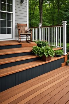 a porch with wooden steps and plants on it