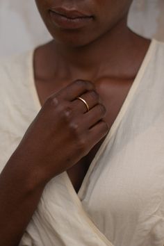 14k recycled gold-plated brass Nickel & lead free Crafted using responsibly sourced and recycled metals Handmade in a solar-powered workshop in rural Malawi The 'Chalu' Ring (meaning 'natural earth' in Tumbuka) is crafted with a wabi-sabi organic design in mind, giving it a rustic, natural feel. The irregular beauty is sure to make a statement, perfect for a special occasion or everyday wear. Crafted from brass coated in a luxuriously thick layer of 14k recycled gold to ensure both longevity and Dainty Hand Forged Gold Stackable Rings, Minimalist Hand Forged Gold Midi Rings, Heirloom Style Everyday Stackable Rings In Recycled Gold, Gold Midi Rings Of Recycled Gold, Everyday Gold Midi Rings Made Of Recycled Gold, Everyday Hammered Recycled Gold Rings, Minimalist Brass Promise Rings, Dainty Hand Forged Rings For Everyday, Everyday Heirloom Jewelry In Recycled Gold