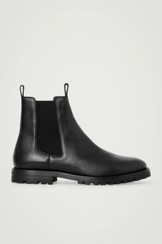 The COS menswear team excel at creating perfected closet staples. Crafted from supple chrome-free leather tanned a deep-black hue, these boots are modeled on classic Chelsea styles and have the trademark elasticated side panels and modern cleated soles. They're innovatively designed with pull tabs at the front and back to prevent creasing the hide when putting them on.  Rubber soles Upper & Lining: 100% Leather, Sole: 100% Recycled rubber Cos Menswear, Black Chelsea Boots, Leather Chelsea Boots, Recycled Rubber, Side Panels, Innovative Design, Panel Siding, Leather Working, Wardrobe Staples