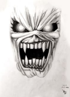 a drawing of a scary face with teeth