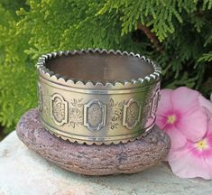 "Stunning Antique Sterling Silver bangle bracelet. This Victorian Bracelet has scalloped outer edges and is just one of the many beautiful details on this Bracelet. Engraved with Ivy leaves, Vines and Roses, with 5 raised decorative Design. It must have been given for a special occasion. Ivy leaves symbolized a union for eternity such as marriage or friendship, because the ivy plant grows upward and bonds to whatever it attaches to. It is stamped Standard Silver, J H, With the Birmingham Anchor Symbol, The England Lion Symbol for Sterling Silver and another mark see pictures for details. These Antique Bracelets with scalloped edges are not very common as those with straight edges or the beaded edges. These pieces were not mass produced, and each piece is truly a beautiful work of art.  The Lion Symbol, Anchor Symbol, Ivy Plant, Victorian Bracelet, Ivy Leaves, Antique Bracelets, Silver Bangle Bracelet, Sterling Silver Bangle Bracelets, Ivy Leaf