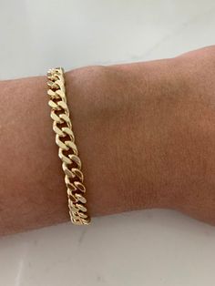 6MM Cuban Link Bracelet | Thick Cuban Bracelet | Statement Bracelet | Link Chain Bracelet | Shiny Bracelet HANDMADE- CUBAN LINK CHAIN BRACELET  ⁙ Materials: 18K Gold filled ⁙ Available Colors: Gold ⁙ Measurements: 7" in length, Links are 6MM wide HOW TO FIND YOUR PERFECT FIT ⁙  Your wrist size is the most important measurement for determining which length will work best for you. To measure, wrap a soft tape measure around your wrist keeping the tape measure perpendicular to the floor as you meas Luxury Modern Cuban Link Silver Chain Bracelet, Luxury Classic Cuban Link Bracelet With Complimentary Chain, Luxury Cuban Link Gold Bracelet, Luxury Gold Cuban Link Bracelet With Polished Finish, Luxury Gold Plated Classic Cuban Link Bracelet, Gold Bracelet Thick, Adjustable Cuban Link Gold Chain Bracelet As Gift, Adjustable Cuban Link Bracelet As Gift, Adjustable Cuban Link Bracelet Gift