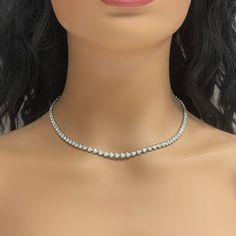 A classic and elegant everyday or occasional wear the Beauvince Adjustable Length Cupcake Tennis Necklace is a timeless and versatile piece of jewelry. It can we worn at any length between 13 inches 30 inches ranging from a choker to a long layer. Total Diamond Weight: 7.18 ct Diamond Color: G - H Diamond Clarity: SI - I (Slightly Included - Included) Metal: 14K White GoldMetal Weight: 18.35 gms Setting: Prong Set Length: 13 - 30 inches Elegant Round Cut Tennis Necklace For Everyday Luxury, Fine Jewelry Single Strand Diamond Necklace, Classic Vvs Clarity Diamond Necklace, Classic Round Bridal Necklace With Vvs Clarity, Solitaire Necklace With 17 Jewels And Round Cut, Fine Jewelry Diamond Choker Necklace For Formal Occasions, Formal Diamond Choker Necklace In Fine Jewelry Style, Formal Fine Jewelry Diamond Choker Necklace, Formal Single Strand Choker