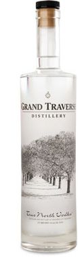 a bottle of grand traverr gin with red cap on the top and white background