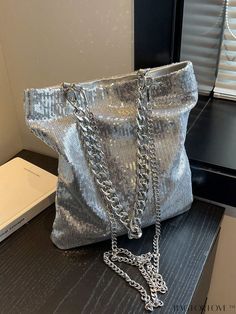 BagForLove - Silver Sequin Square Bag with Metallic Chain: Stylish and Unique Product Description Color Silver Bag Size Medium Pattern Type Plain Material Polyester Composition 50% Viscose Size Chart INCH CM Bag Height Bag Length Bag Width Handle Height 11.8 inch 9.8 inch 1.6 inch 10.2 inch Bag Height Bag Length Bag Width Handle Height 30 cm 25 cm 4 cm 26 cm Details Pictures Similar Products h2 { text-align: center; } /* æ¢è¡ */ li{ white-space: normal; word-break: break-all; word-wrap: break- Large Capacity Silver Party Bag, Silver Large Capacity Shoulder Bag For Party, Party Shoulder Bag With Chain Strap And Bucket Shape, Party Shoulder Bag With Chain Strap In Bucket Shape, Party Bucket Shoulder Bag With Chain Strap, Silver Chain Bag For Night Out, Silver Bucket Bags With Chain Strap, Silver Tote Bag For Party, Large Capacity Tote Evening Bag For Party