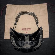 [Kenzo] Black Tan Leather Patchwork Face Metal Handle Bag With Dust Bag Metal Ring Handle Connected Irregularly: Messed Up (You Can Make It Better Shape) Like New Designer Leather Evening Bag, Designer Black Evening Bag With Removable Pouch, Designer Leather Evening Bag For Party, Designer Black Evening Bag, Designer Black Clutch Evening Bag, Black Leather Evening Bag, Leather Patchwork, Ring Handle, Metal Ring