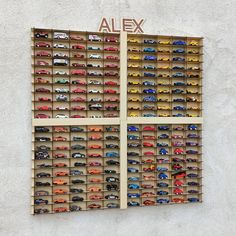 there are many cars on display in the wall