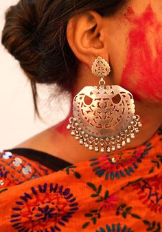 Jhumri Intricate Carved Classic Chandbali Earrings. All our jewellery is handcrafted. Crafted in Oxidized 925 Silver. This piece of art is absolutely extraordinary and requires long involvement with metal handling, and individual devotion for magnificent finishing. Length : 10cm Max width : 6cm 92.5 Silver, Hallmarked Available as a Pair Care tips: Keep jewelry away from hard and rough objects. Store your jewellery in a soft lined box or pouch. This unique designer earring is hand-crafted from solid sterling silver , it is vintage finished and oxidised for ethnic look, a unique work of our craftsmen. Please feel free to contact us anytime regarding any quarries related to our jewelry. We will be pleased to assist you. We are a duo of IIT Roorkee graduate, ex Flipkart and an MBA from Nirma Silver Fusion Bridal Earrings With Intricate Design, Silver Temple Jewelry Chandelier Earrings With Intricate Design, Fusion Style Latkan Earrings For Rituals, Handmade Sterling Silver Bridal Earrings For Festive Occasions, Sterling Silver Chandbali Danglers In Temple Jewelry Style, Sterling Silver Chandbali Temple Jewelry Danglers, Traditional Handmade Sterling Silver Chandelier Earrings, Handmade Temple Jewelry Earrings For Rituals, Silver Chandbali Bridal Earrings With Cutdana