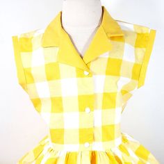 This is an adorable yellow gingham print shirt dress, has a yellow collar and sleeve cuffs. I could also make it out of different fabrics. This dress is shown with an underskirt that can be purchased in my shop for an additional $10. https://www.etsy.com/listing/116097306/tulle-underskirt-made-to-order?ref=shop_home_active Thank you for checking out my listing! Retro Gingham Plaid Cotton Dress, Classic Gingham Short Sleeve Dress, Collared Gingham Dress For Spring, Classic Short Sleeve Gingham Dress, Fitted Cotton Plaid Dress In Preppy Style, Fitted Plaid Cotton Dress In Preppy Style, Preppy Fitted Plaid Cotton Dress, Classic Gingham Dress With Short Sleeves, Retro Yellow Dress For Picnic