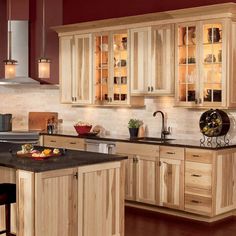 a kitchen filled with lots of wooden cabinets and counter top space next to an oven