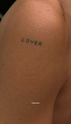 a woman's back with the word lover written on it