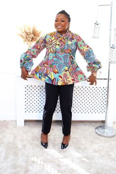 This versatile Ankara top allows you to express your unique sense of style while celebrating the rich heritage of African prints Fitted Multicolor Printed Blouse, Fitted Abstract Print Blouse, Fitted Multicolor Vibrant Print Blouse, Fitted Blouse With Multicolor Vibrant Print, Fitted Multicolor Blouse With Abstract Print, Chic Multicolor Abstract Print Blouse, Multicolor Long Sleeve Blouse With Bold Print, Chic Patterned Tops With Abstract Print, Chic Fitted Multicolor Print Blouse