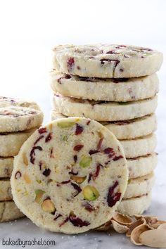 several cookies stacked on top of each other with nuts and dried fruit in the middle