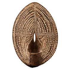 an intricately designed wooden object on a white background