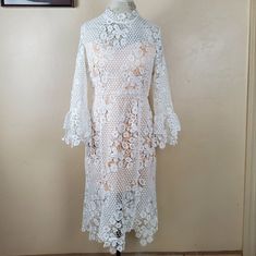 New Free People Floral Crochet Lace La Spezia Dress Size Large Never Worn High Neck Style Midi Length Bell Sleeves Lined With A Nude Sleeveless Half-Slip Cream Lace And Beige Lining Open Back Hidden Back Zip Closure Hand Wash Approximate Measurements: Underarm To Underarm 19 Inches Length 42 Inches Vintage Antique/Bohemian Style Sheer Floral Crochet Lace Dress. Would Be Great For A Casual Elopement, Bridal Shower, Wedding Rehearsal, Dinner Party Or Even Just Casual Wear! Fitted Crochet Lace Dress For Spring, White Fitted Crochet Dress For Spring, Long Sleeve Crochet Lace Dress, White Lace Dress With Long Sleeves, Elegant White Crochet Dress For Spring, White Lace Dress With Lace Sleeves For Beach, White Crochet Lace Dresses, White Midi Dress With Lace Sleeves For Summer, Chic White Crochet Dress For Wedding