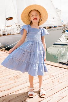 Introducing the Mini Indie Dress in Blue Gingham, a charming addition to our Summer Collection! She's here in this darling blue & white gingham fabric, perfect for summer! She also features a sweet square neckline with ruffle detailing at the shoulders & half-length flutter sleeves! Absolutely perfect for sunny celebrations, the Mini Indie Dress combines classic style that your mini will love!! Don't forget the matching styles for the WHOLE family!! Purple Gingham Toddler Dress, Old Navy Blue Gingham Dress, Indie Dress, Indie Dresses, Blue And White Gingham, Picnic Dress, Gingham Fabric, Red Gingham, Blue Gingham