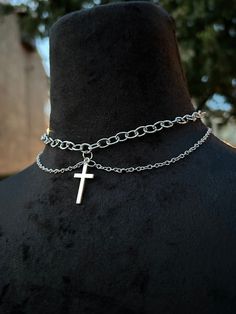 Unique alternative layered cross choker necklace, perfect feminine outfit addition for any night out! Handmade silver necklace accessory adorned with a cross pendant Trendy Cross-shaped Metal Jewelry, Trendy Silver Cross Jewelry, Trendy Cross-shaped Jewelry With Adjustable Chain, Trendy Cross Necklace With Adjustable Chain, Gothic Silver Chain Choker, Elegant Silver Cross Choker, Cross-shaped Metal Choker For Gifts, Adjustable Metal Cross Necklace, Crucifix Metal Jewelry