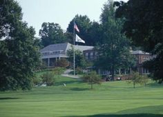 a view of a golf course from across the field