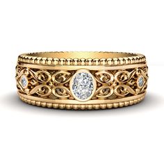 an intricately designed wedding band with a round diamond in the center and two smaller diamonds on