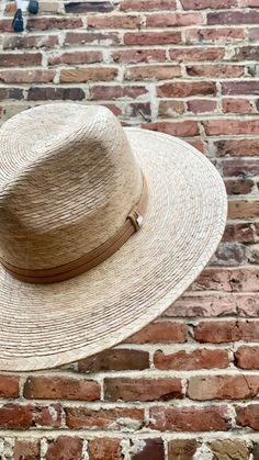 Handmade by artisans in Mexico, our new 100% baked palm leaf Islander Hat is perfect for spring and summer wear. Featuring a molded crown and tightly woven pressed palm, this hat offers the most sun protection. Embellished with a faux suede band and exclusive cut Swarovski crystals. - Hat is one size fits all and the band on the inside is stretchy. If you think you’ll want a tighter fit or have a smaller head, we can attach a foam piece behind the band to reduce the size. - Can be removed. REQUE Artisan Woven Straw Hat For Spring, Bohemian Natural Panama Hat For Kentucky Derby, Adjustable Handwoven Straw Hat For Kentucky Derby, Handwoven Adjustable Straw Hat For Kentucky Derby, Artisan Woven Panama Hat For Spring, Artisan Straw Hat With Curved Brim For Spring, Adjustable Short Brim Panama Hat In Palm Leaf, Adjustable Short Brim Panama Hat, Classic Palm Leaf Hats For The Beach