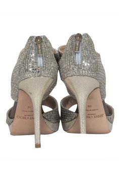 Embrace the epitome of glamour and beauty with these Jimmy Choo champagne gold heels, featuring an open-toe design, pair these heels with a sleek midi dress and a bold clutch for a modern evening look, or add a touch of sparkle to your daytime outfit with a cropped trousers and silk blouse. Size 8 (IT 38) Made in Italy Glitter fabric Leather sole & insole with minimal wear Exposed back zipper closure Gold-toned hardware Platform height 0.7” Heel height 4.7” Champagne Heels With 4-inch Heel For Gala, Chic Sparkling Ankle Strap Heels, Metallic Heels With 4-inch Heel For Gala, Glamorous Almond Toe Sandals With 4-inch Heel, Chic Open Heel Party Heels, Holiday Heels With Heel Strap For Night Out, Chic Evening Sandals For Party Season, Chic Evening Sandals For Party, Glamorous Open Toe Heels For Cocktail